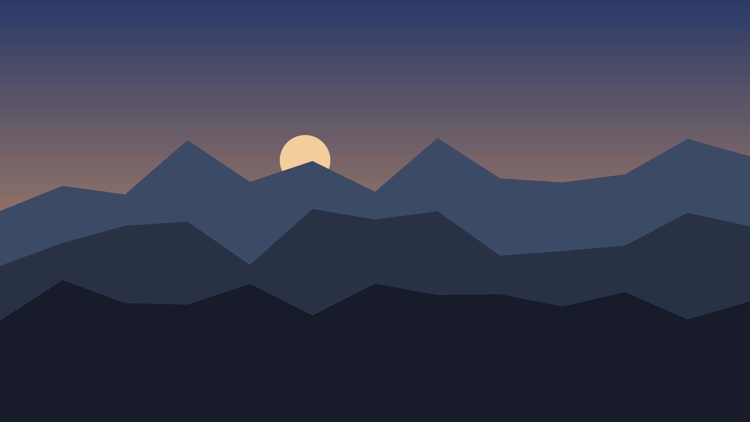 Mountain ridges silhouetted against a warm dusk sky